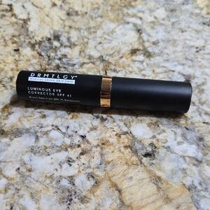 DRMTLGY Luminous Eye Corrector SPF 41 - Black and Gold